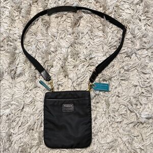 Coach Black Crossbody Pouch with Teal Accent Tags